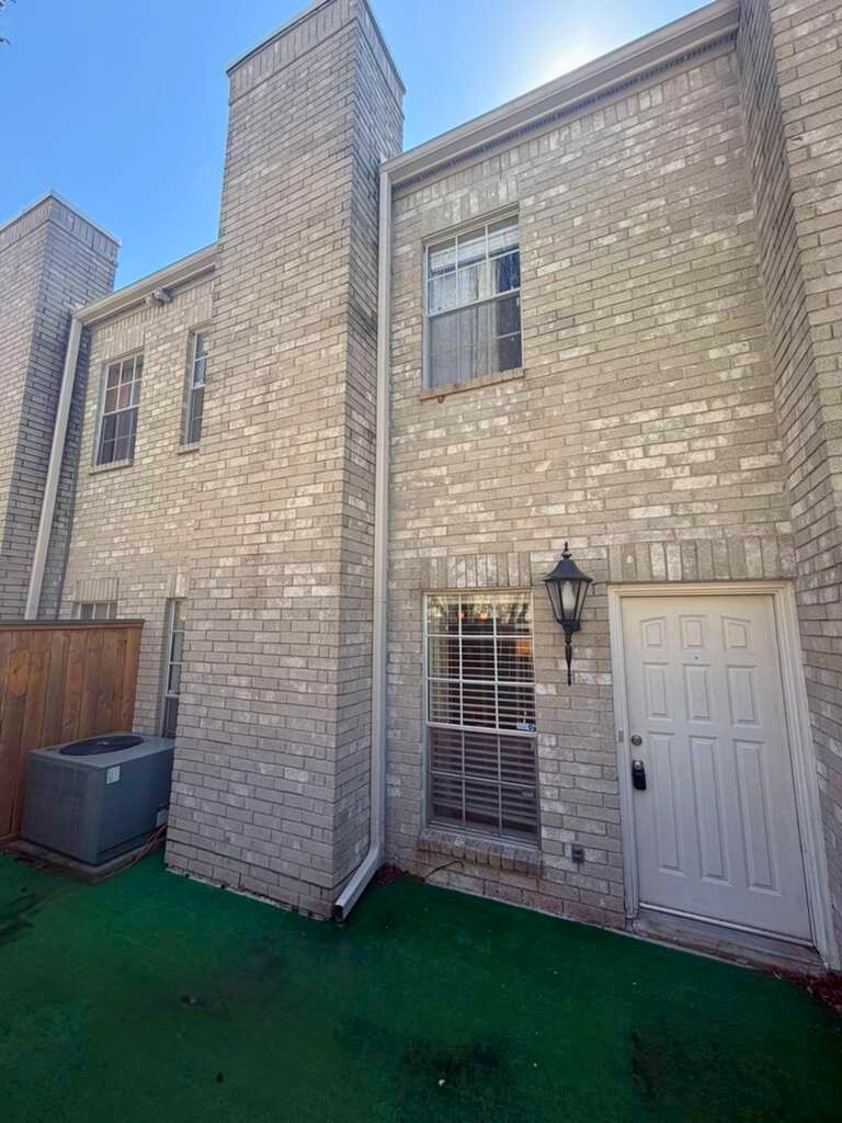 3780 Tanglewilde Street, Unit 306 Houston, TX 77063 - Photo 2 of 22 a view of a backyard with wooden fence