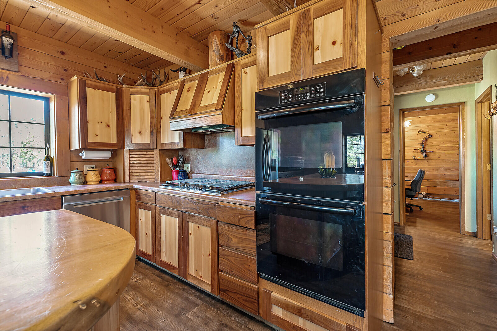 1501 North Obenchain Road Eagle Point, OR 97524 - Photo 31 of 68 a kitchen with stainless steel appliances granite countertop a stove and a microwave