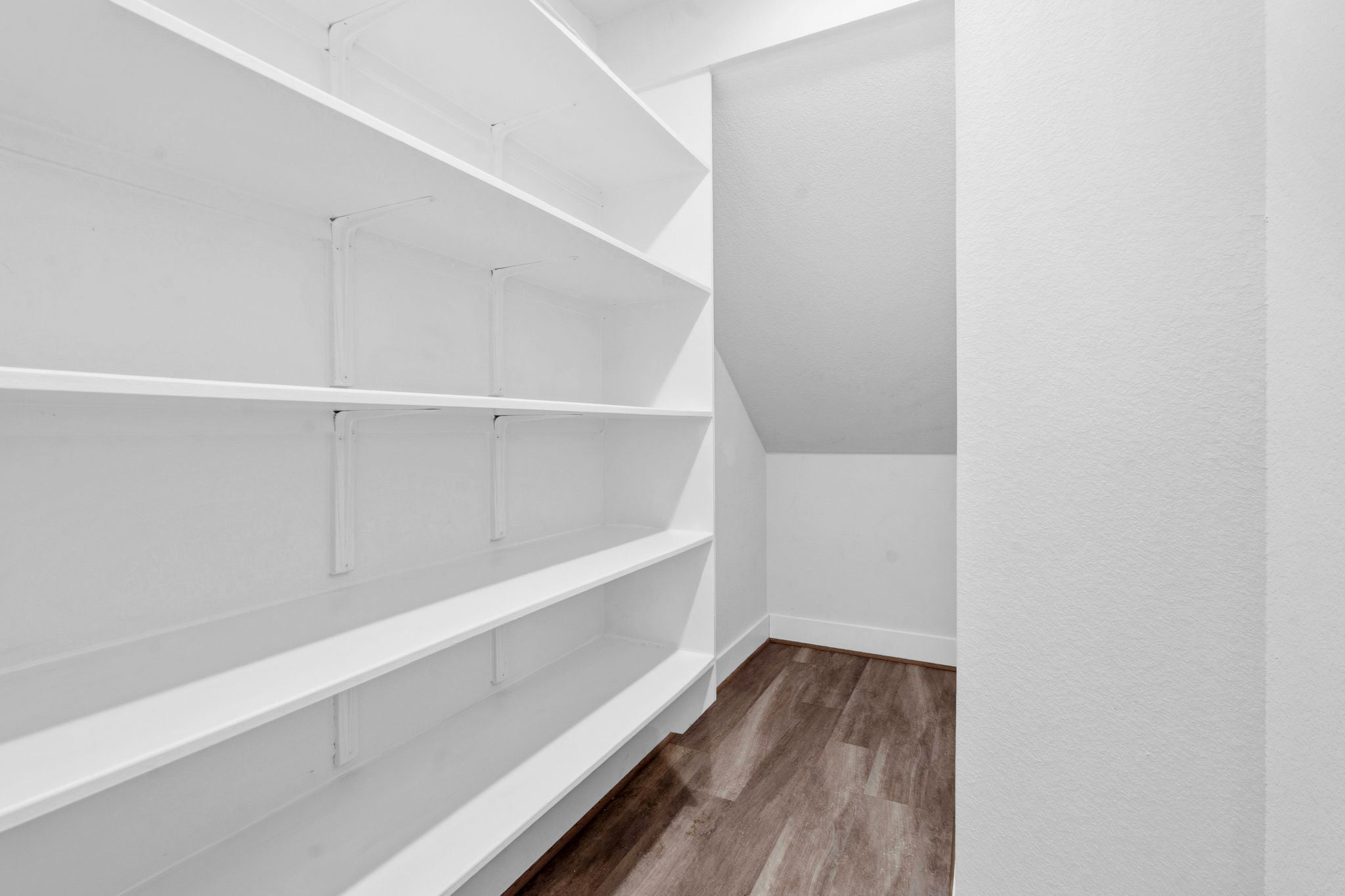 7105 Silver Star Lane, Unit 59 Austin, TX 78744 - Photo 7 of 19 a view of an empty walk in closet