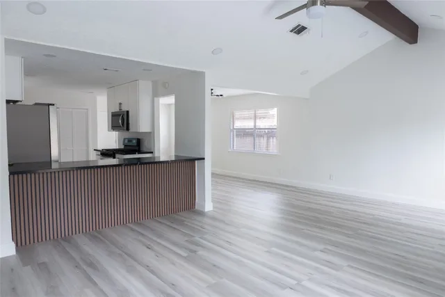 a view of a kitchen from the hallway