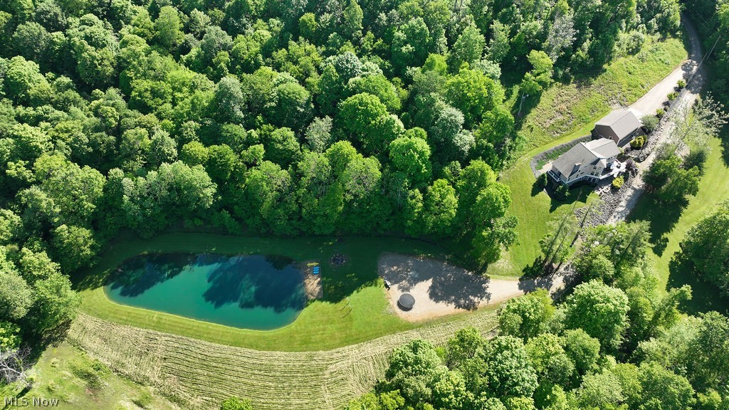 5234 Ribbon Road Southwest Bowerston, OH 44695 - Photo 3 of 50 Aerial view of home featuring a pond