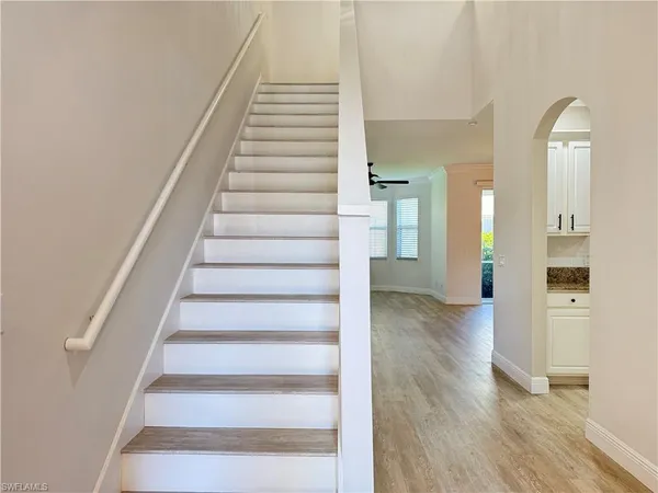 a view of an entryway with wooden floor