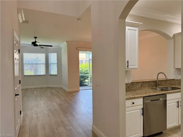 a kitchen with sink and window