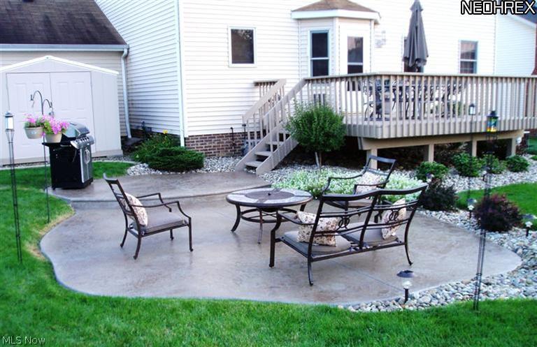 32965 Pettibone Road Solon, OH 44139 - Photo 23 of 25 How about some outdoor dining or entertaining? You can do it all. A large deck and 2 tier stamped concrete patio surrounded with nice landscaping. There is even a gas line hookup for the grill on the patio....no more running out of propane in the middle of grilling!