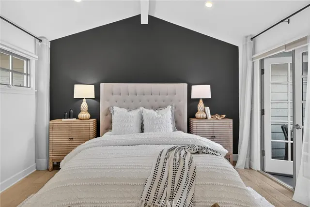 a bedroom with a bed and a lamp