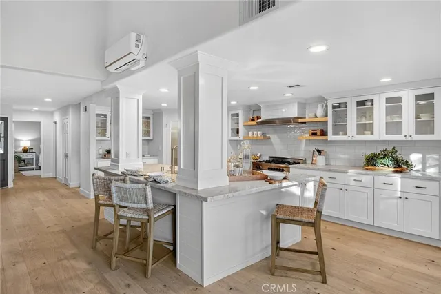 a kitchen with kitchen island granite countertop wooden cabinets and counter space
