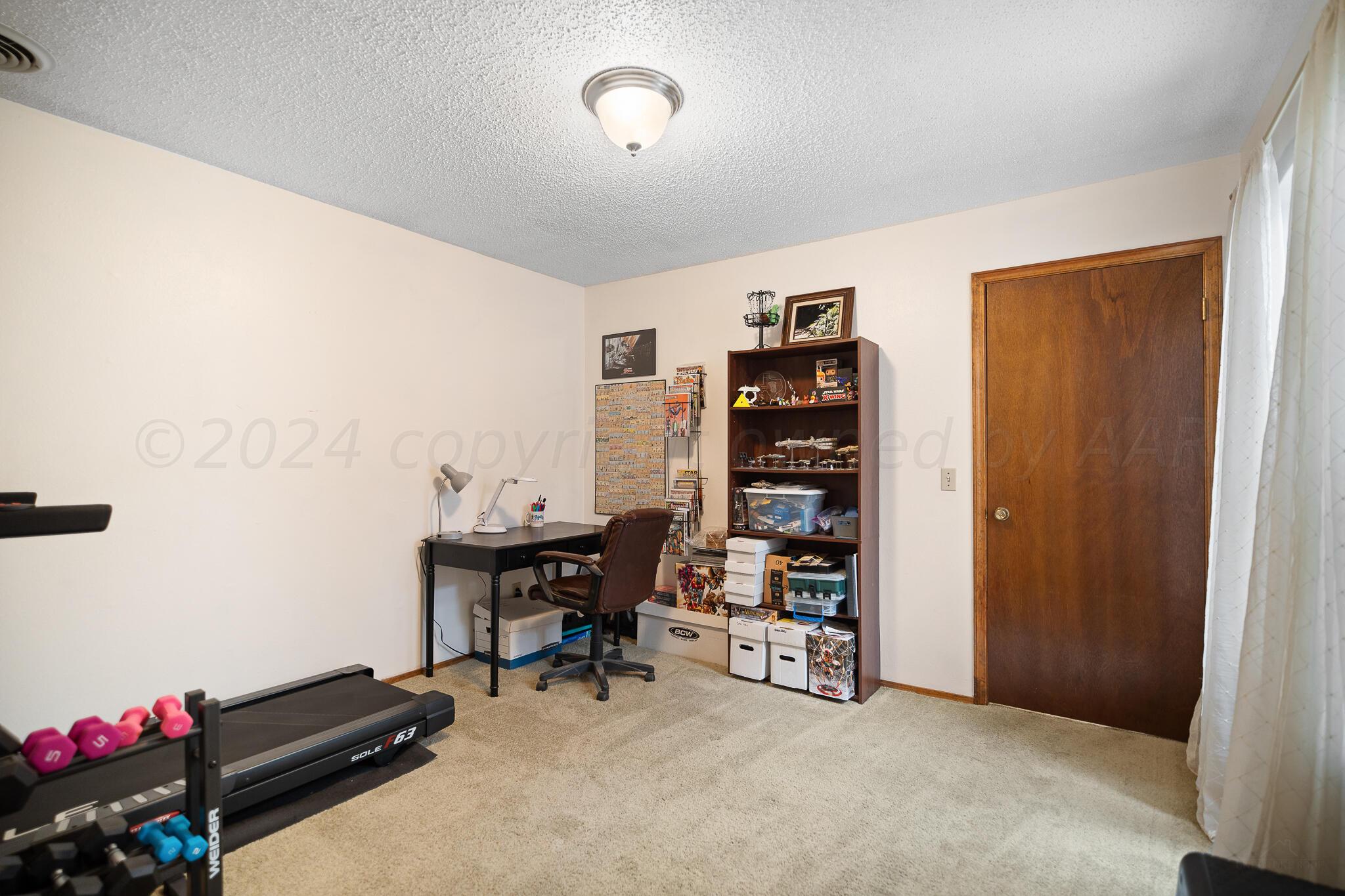 4202 Charles Street Amarillo, TX 79106 - Photo 20 of 25 a view of a workspace with furniture