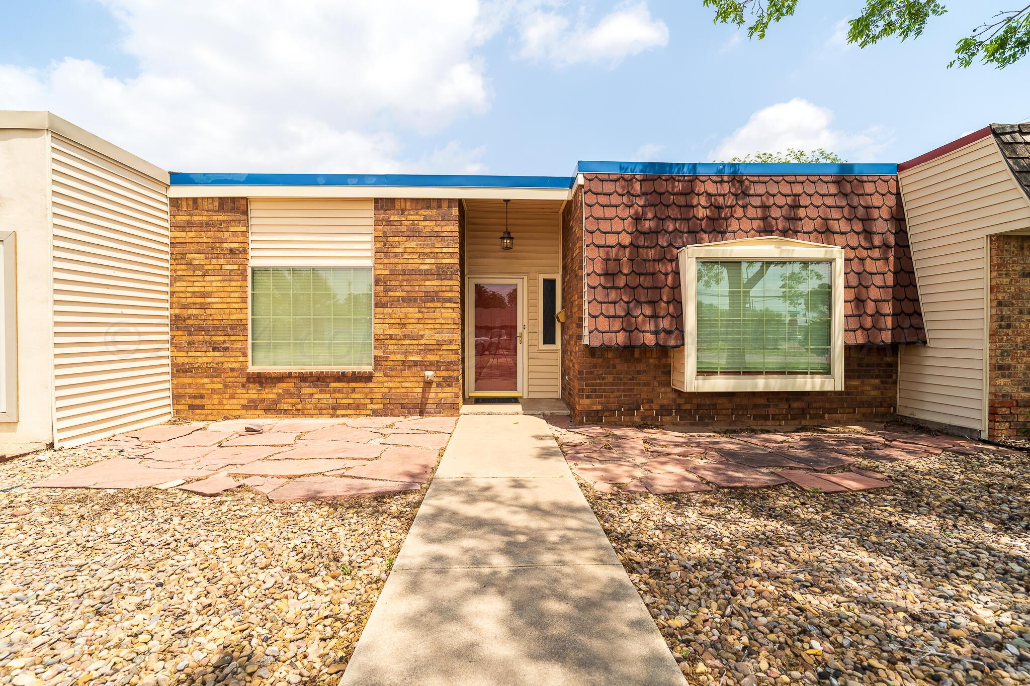 4202 Charles Street Amarillo, TX 79106 - Photo 2 of 25 a backyard of a house
