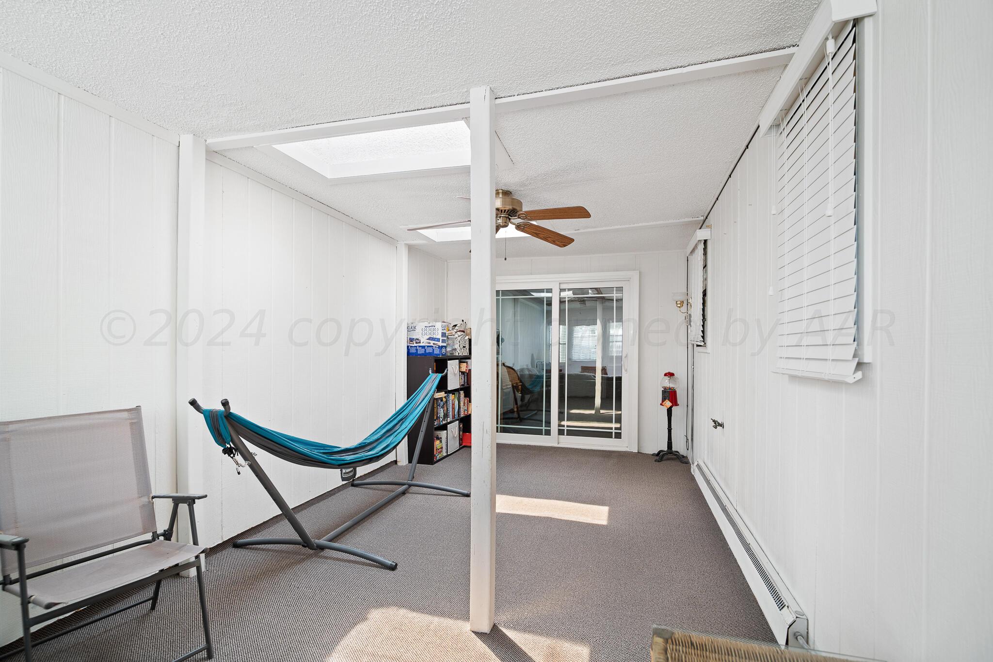 4202 Charles Street Amarillo, TX 79106 - Photo 21 of 25 a view of a hallway with furniture and a window