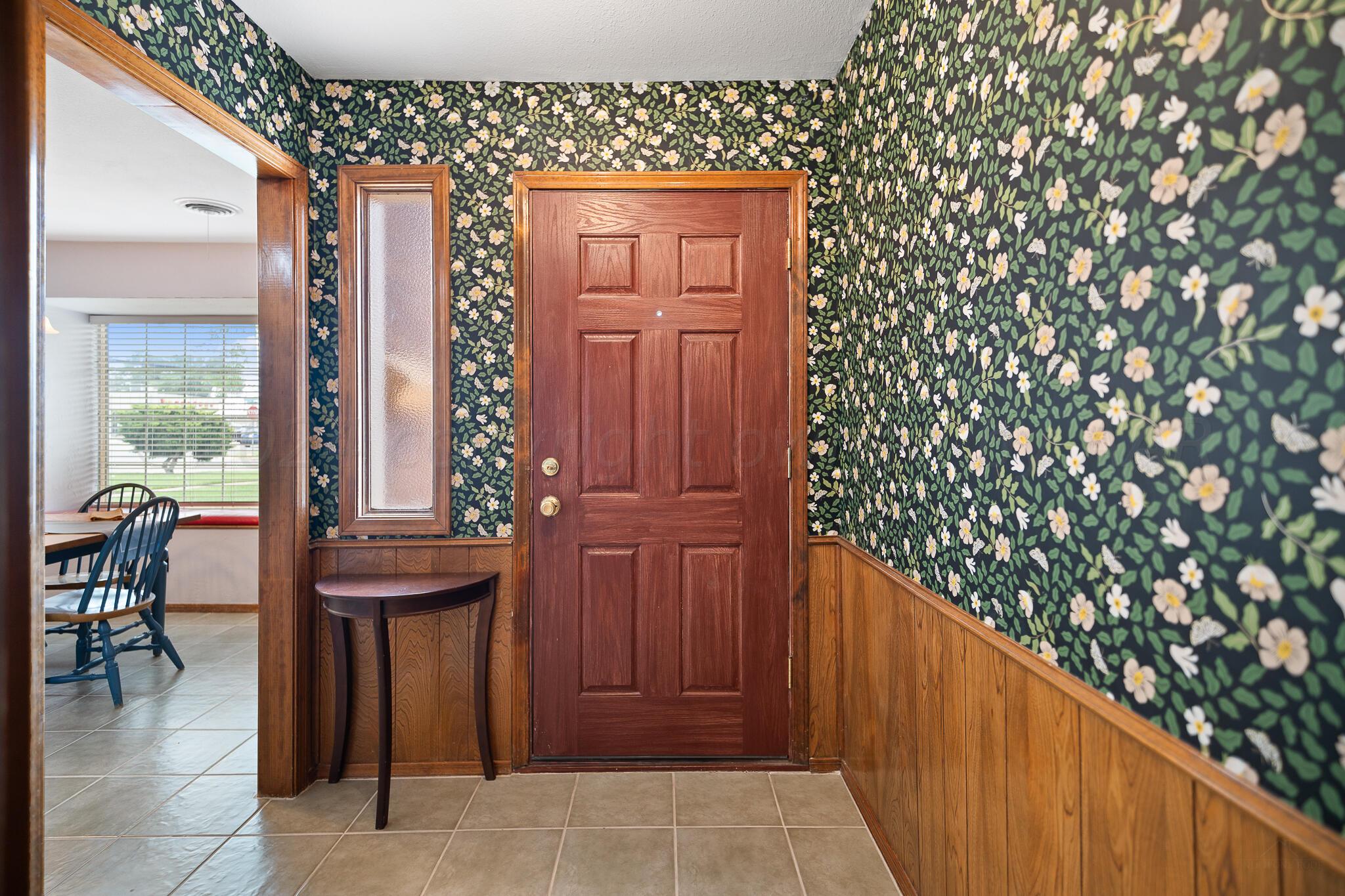 4202 Charles Street Amarillo, TX 79106 - Photo 4 of 25 a view of a entryway door and outdoor seating