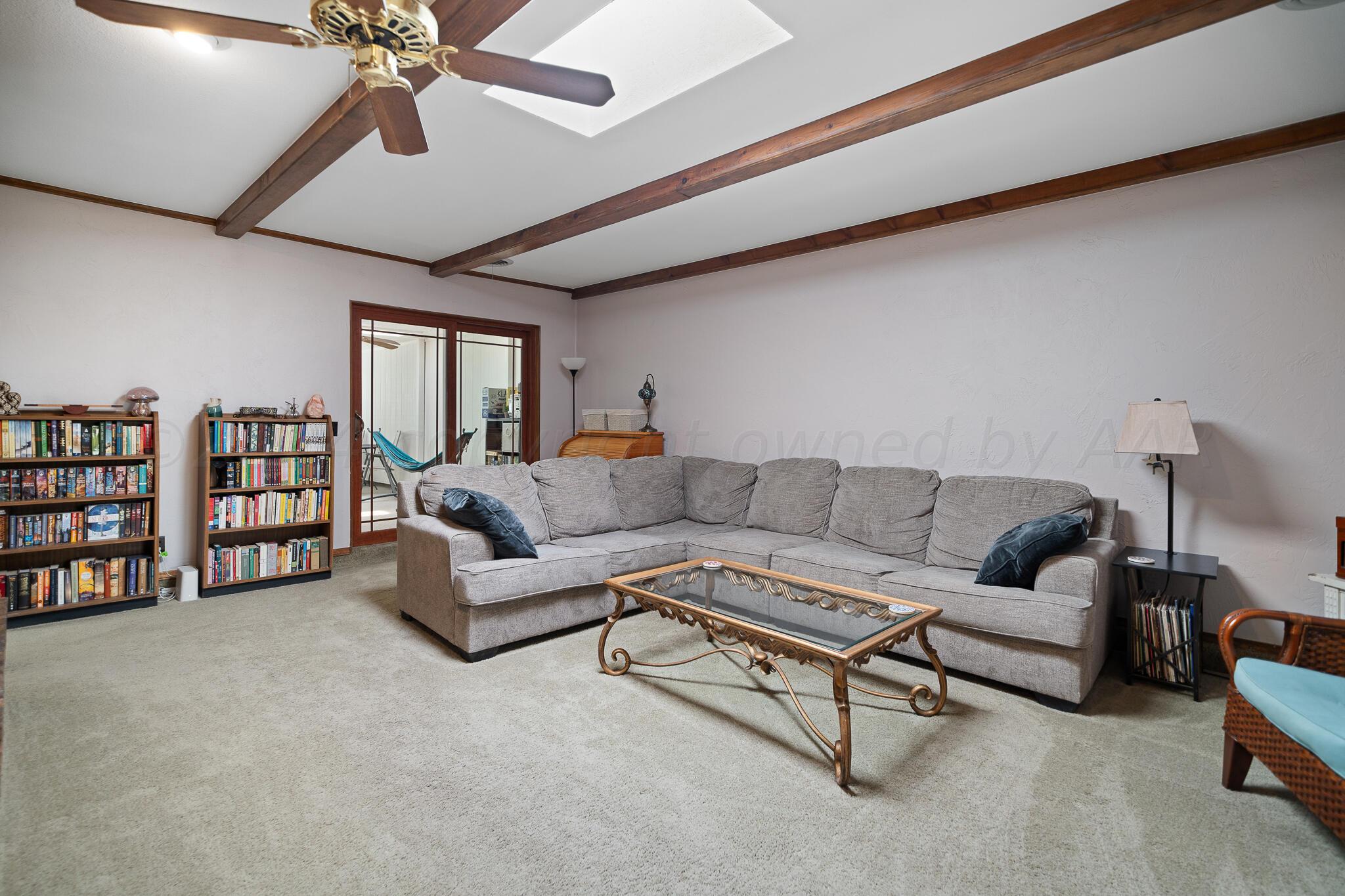 4202 Charles Street Amarillo, TX 79106 - Photo 5 of 25 a living room with furniture and a large window