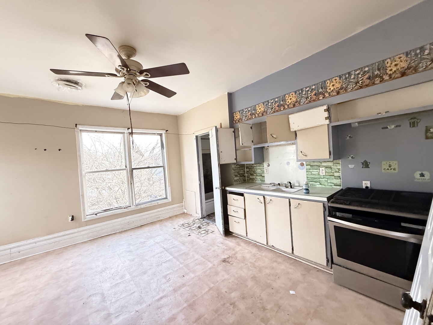 101 5th Street Carmi, IL 62821 - Photo 10 of 28 a kitchen with granite countertop a stove a sink and a refrigerator