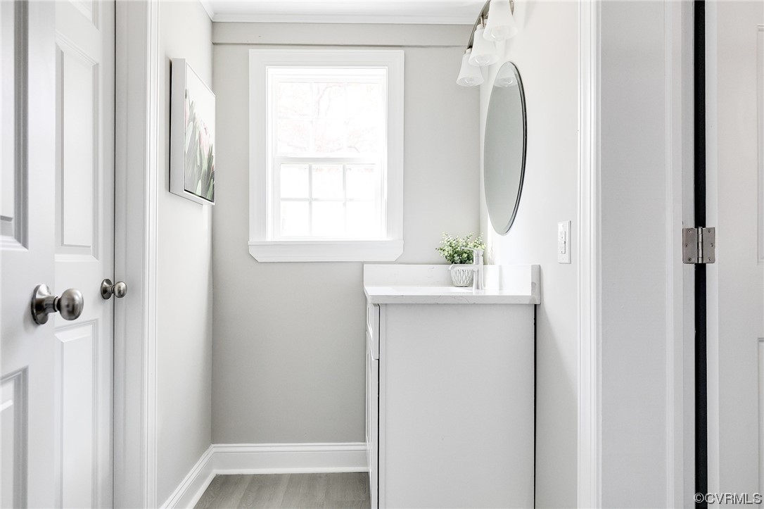 2225 Brookwood Road Richmond, VA 23235 - Photo 20 of 34 a bathroom with a sink a window and a mirror