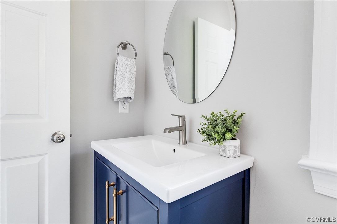 2225 Brookwood Road Richmond, VA 23235 - Photo 22 of 34 a bathroom with a sink and a mirror