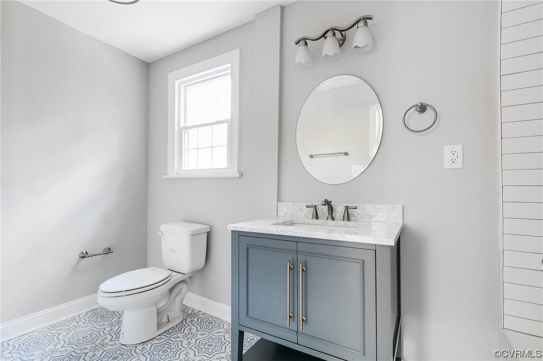2225 Brookwood Road Richmond, VA 23235 - Photo 26 of 34 a bathroom with a toilet sink and mirror