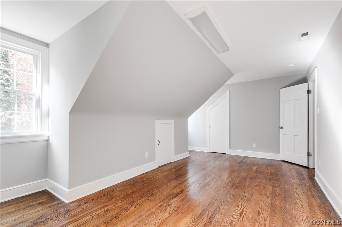 2225 Brookwood Road Richmond, VA 23235 - Photo 29 of 34 an empty room with wooden floor and windows