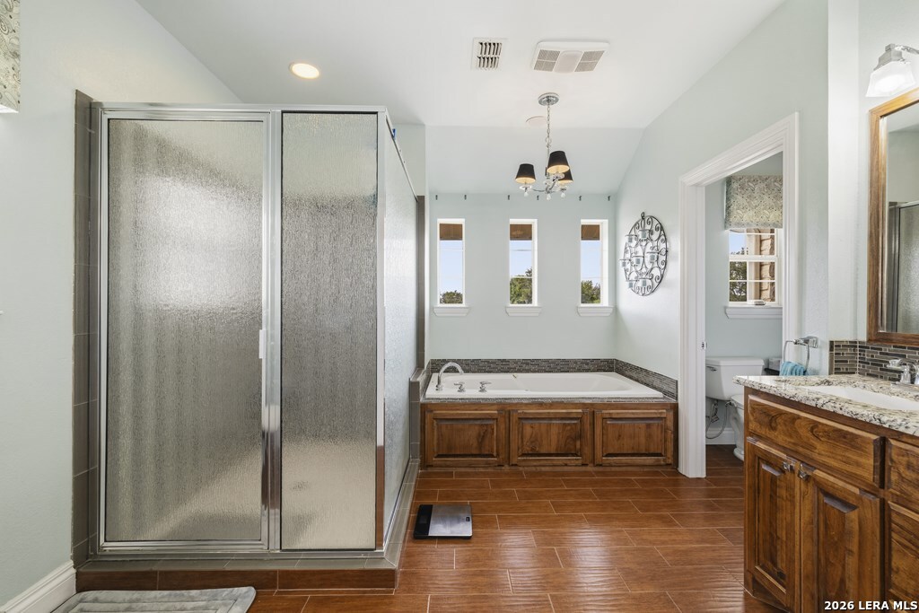 360 Bluff Creek Road North Center Point, TX 78010 - Photo 18 of 64 a bathroom with a tub a sink and a mirror