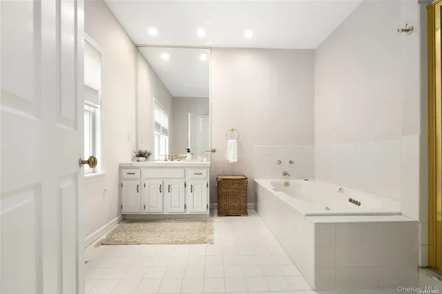 a bedroom with two beds and painting on the wall