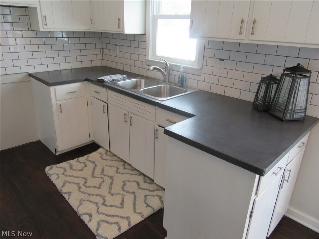 6 Mishler Road Hartville, OH 44632 - Photo 4 of 35 Kitchen with concrete counters, subway tile backsplash and stainless sink