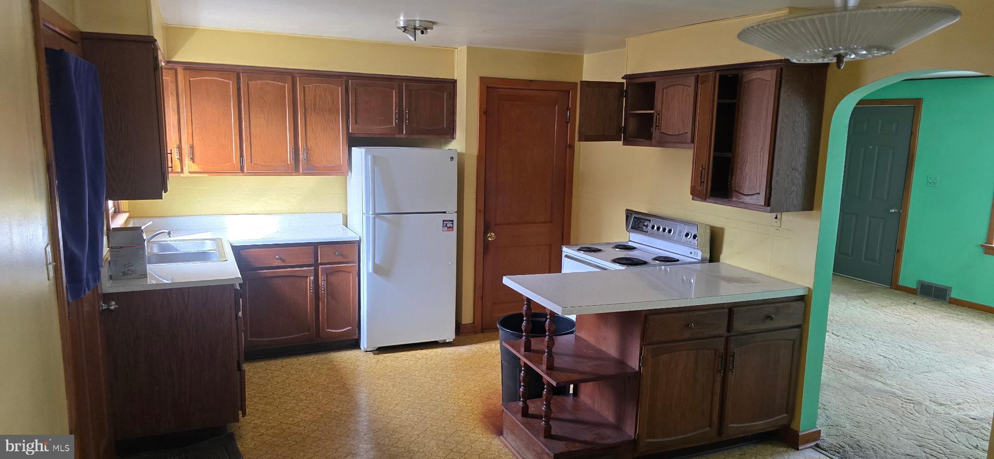 901 Garver Street Roaring Spring, PA 16673 - Photo 8 of 28 Bright kitchen with classic wooden cabinetry.