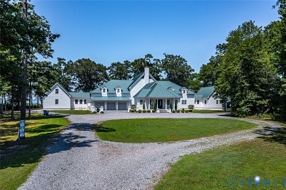 3315 Windmill Point Road White Stone, VA 22578 - Photo 14 of 49 a front view of a house with garden