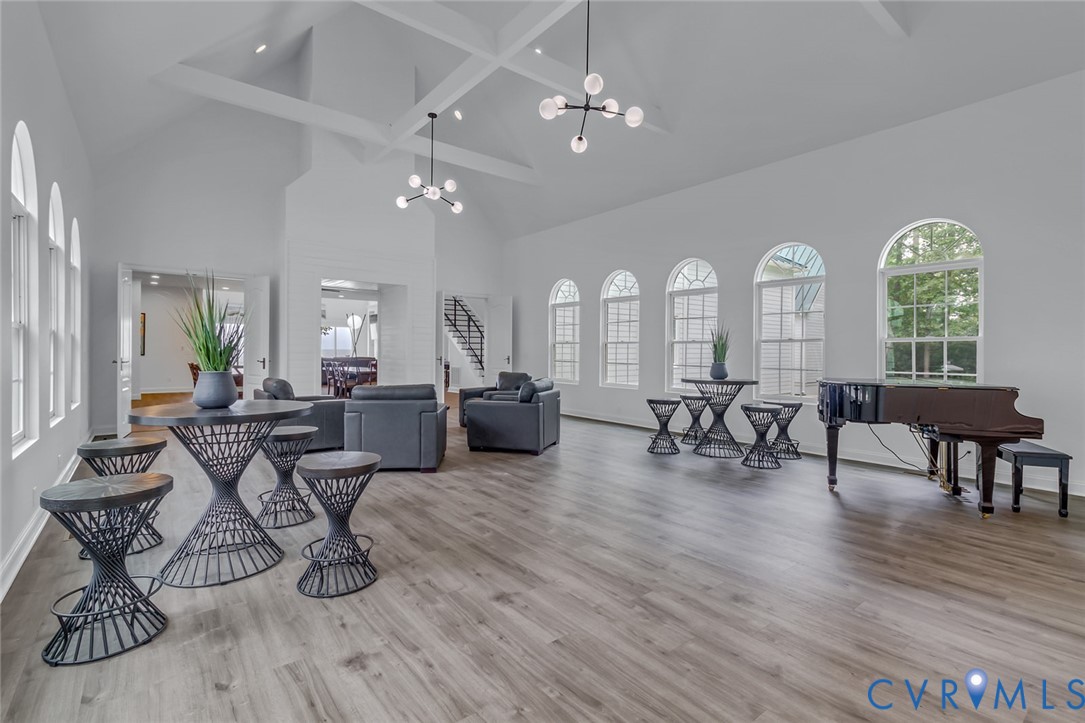 3315 Windmill Point Road White Stone, VA 22578 - Photo 15 of 49 a living room with furniture a dining table and a large window