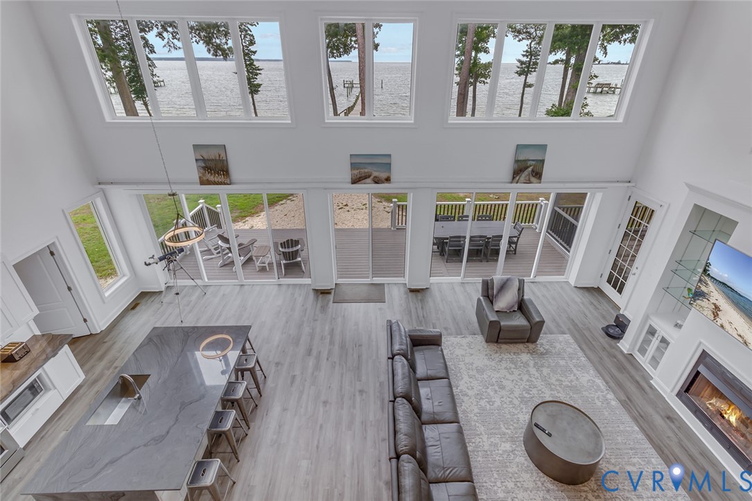 3315 Windmill Point Road White Stone, VA 22578 - Photo 20 of 49 view of living room with furniture and a floor to ceiling window