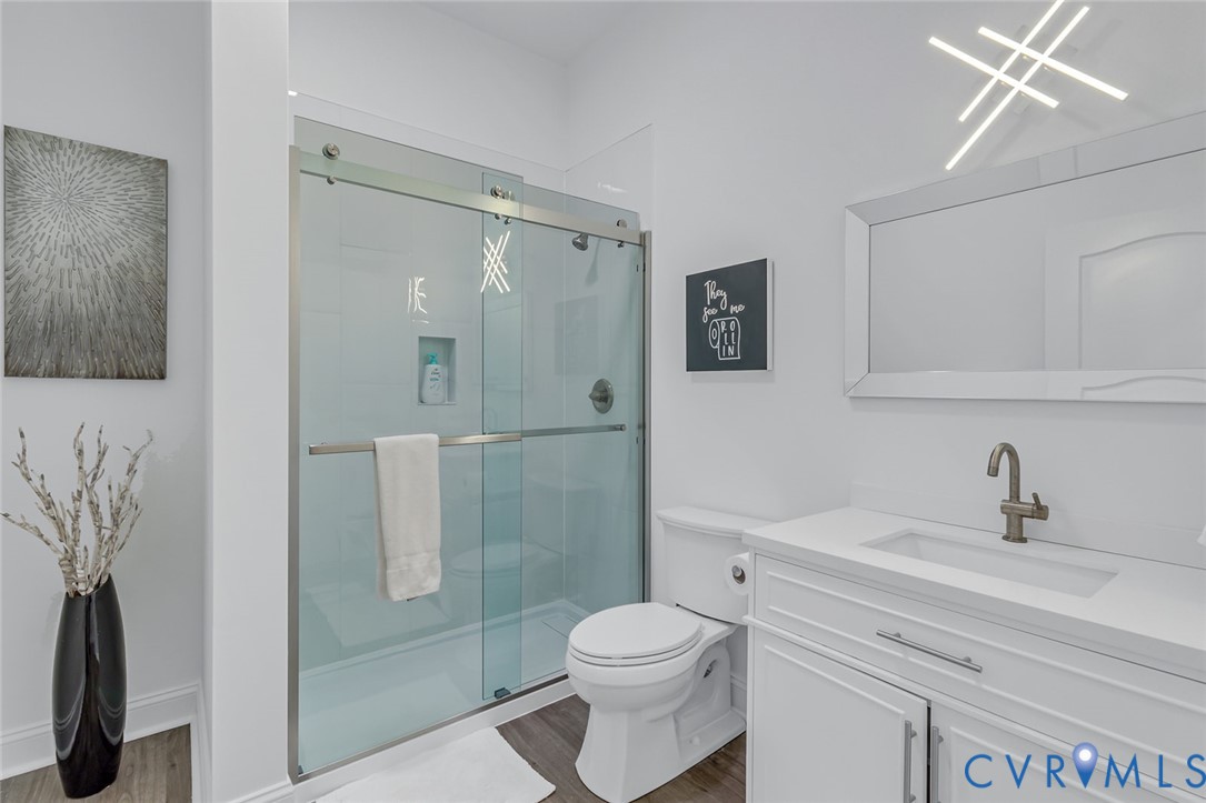 3315 Windmill Point Road White Stone, VA 22578 - Photo 25 of 49 a bathroom with a sink a toilet and shower