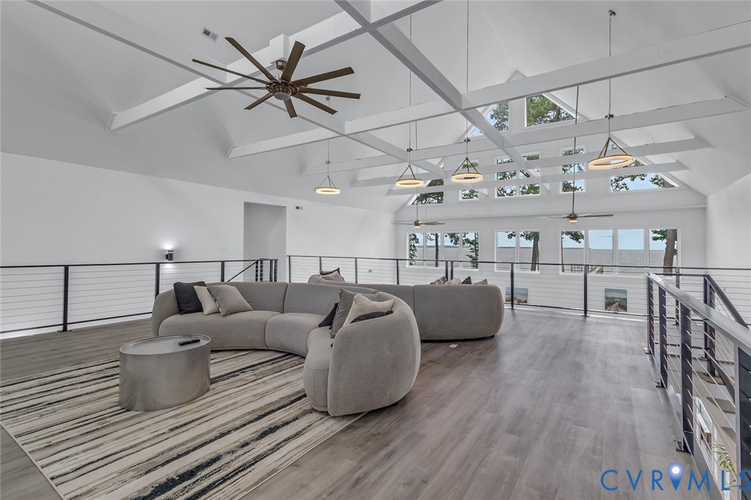 3315 Windmill Point Road White Stone, VA 22578 - Photo 29 of 49 a living room with lots of furniture and wooden floor