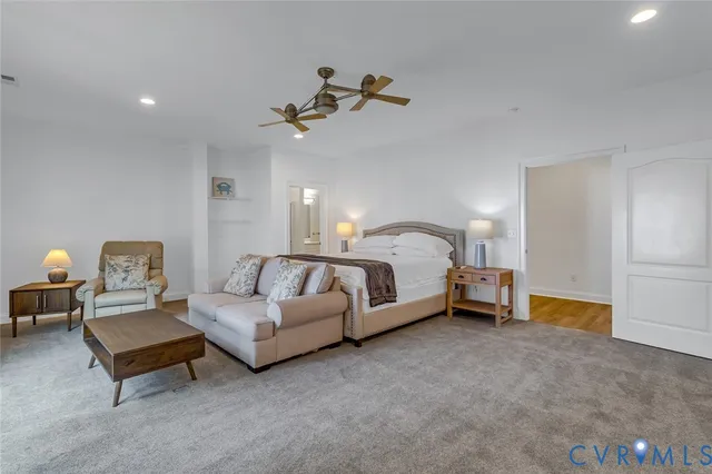 a bed room with a bed and a chandelier