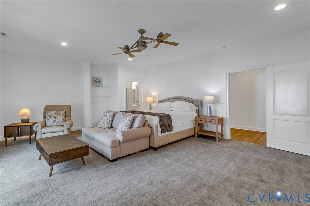 3315 Windmill Point Road White Stone, VA 22578 - Photo 34 of 49 a bed room with a bed and a chandelier