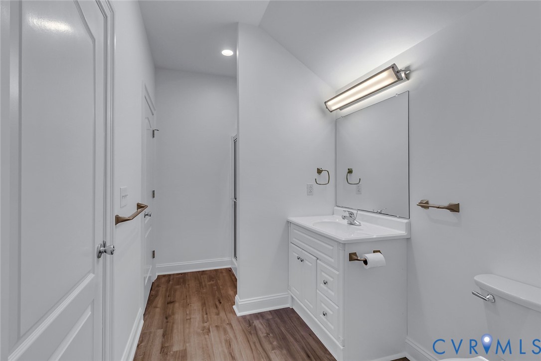 3315 Windmill Point Road White Stone, VA 22578 - Photo 35 of 49 a bathroom with a sink and mirror with toilet