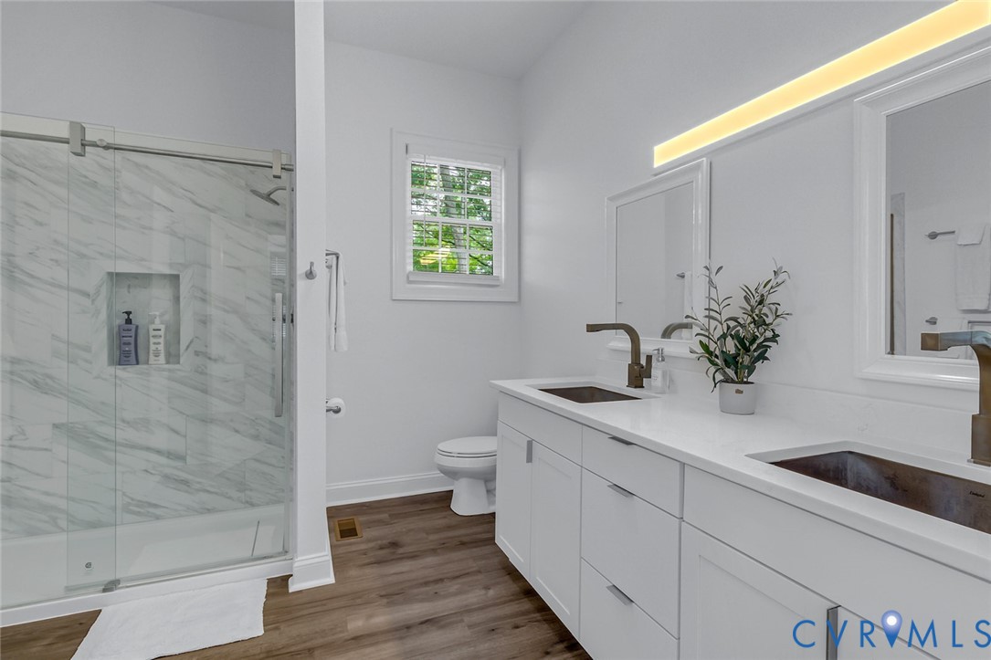 3315 Windmill Point Road White Stone, VA 22578 - Photo 39 of 49 a bathroom with a sink a toilet and shower