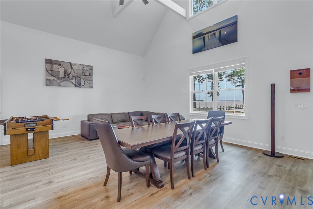 3315 Windmill Point Road White Stone, VA 22578 - Photo 44 of 49 a view of a dining room with furniture and wooden floor