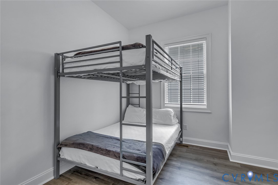 3315 Windmill Point Road White Stone, VA 22578 - Photo 47 of 49 a bedroom with a bed and a window