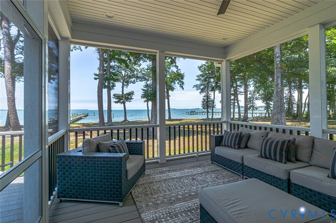 3315 Windmill Point Road White Stone, VA 22578 - Photo 9 of 49 a balcony with furniture and wooden floor