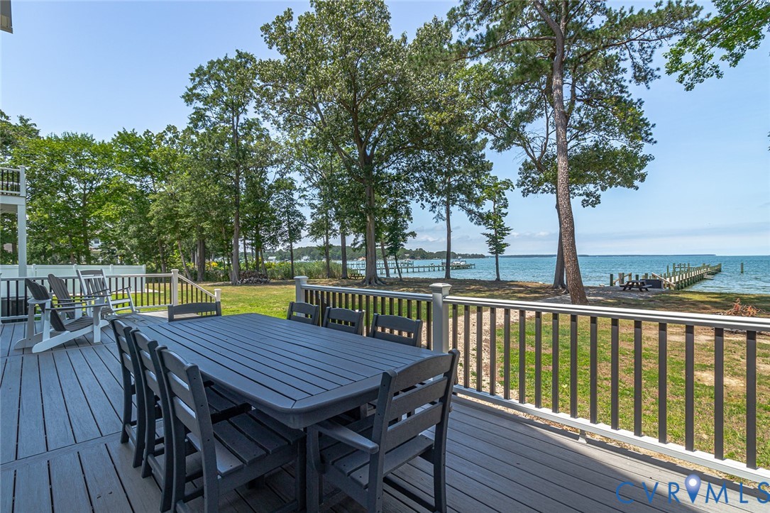 3315 Windmill Point Road White Stone, VA 22578 - Photo 10 of 49 a view of a table and chairs on the roof deck