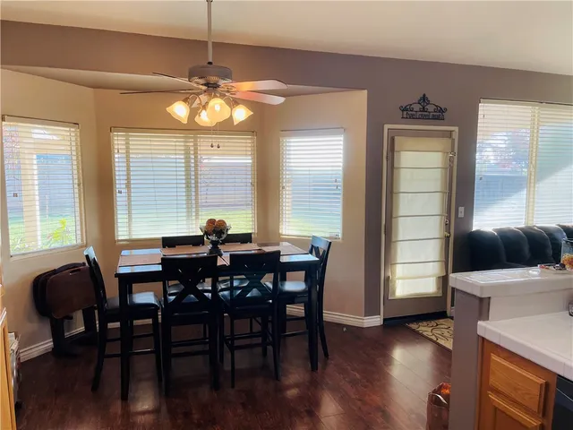 a view of hallway with wooden floor