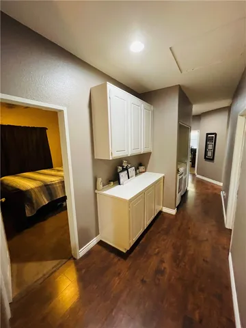 a bedroom with a bed and dresser