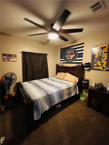 a bedroom with a bed and a closet