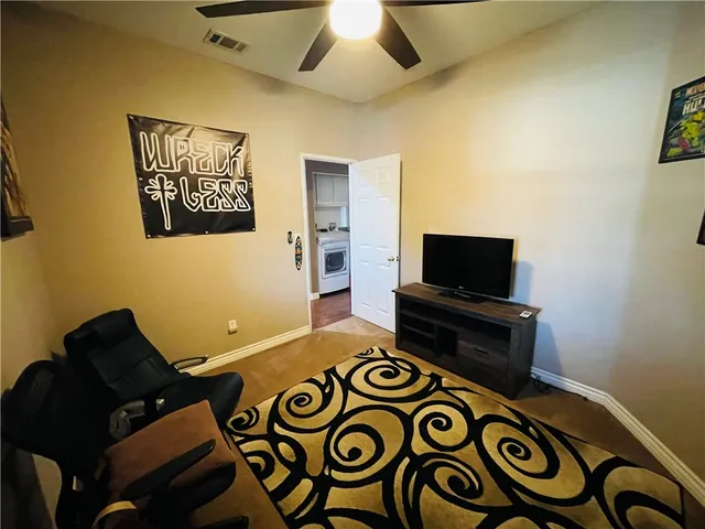 a bedroom with bed and window