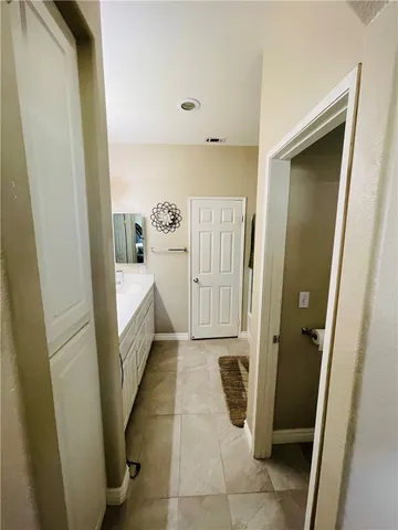 a bathroom with a tub and a mirror