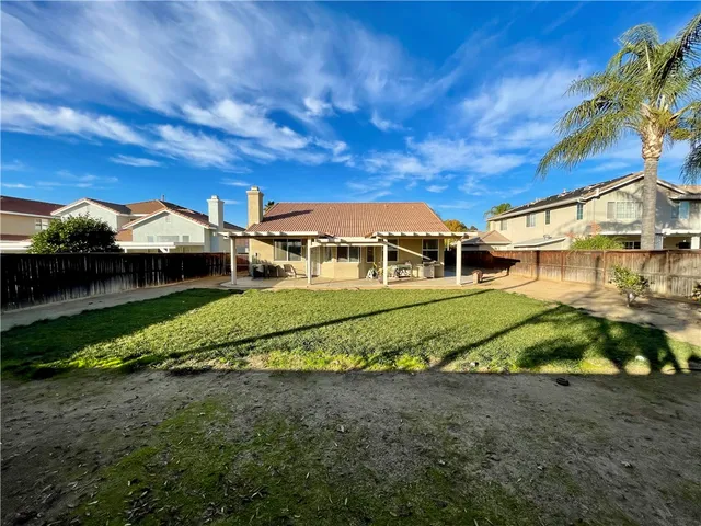 a view of a big house with a big yard