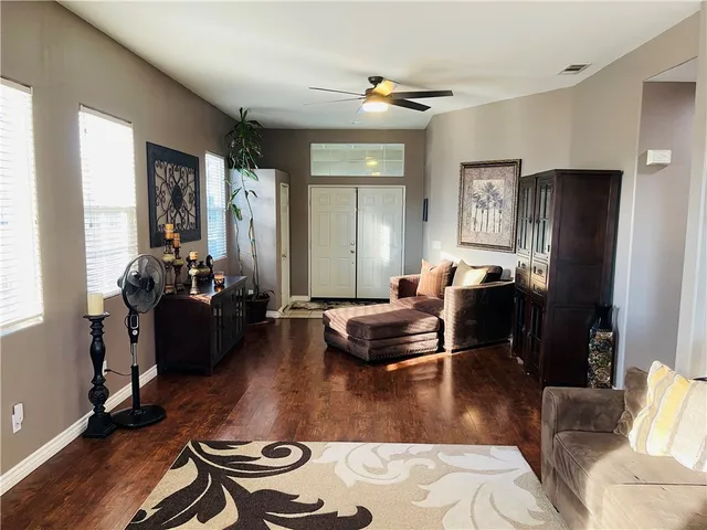 a living room with furniture or couch and a fireplace
