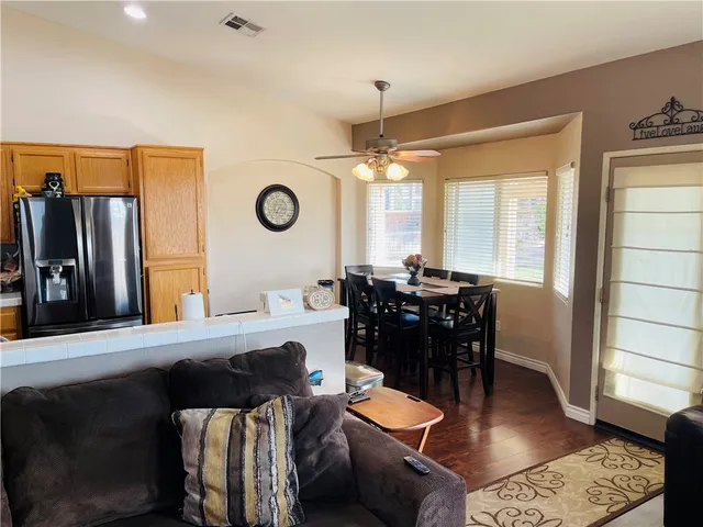 a kitchen with stainless steel appliances a stove refrigerator sink and microwave