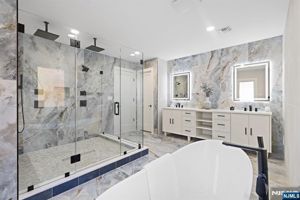 187 Brookfield Avenue Paramus, NJ 07652 - Photo 13 of 22 a bathroom with a tub shower sink and mirror