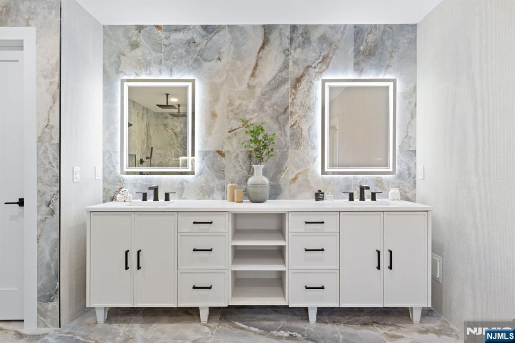 187 Brookfield Avenue Paramus, NJ 07652 - Photo 14 of 22 a bathroom with a sink vanity and mirror