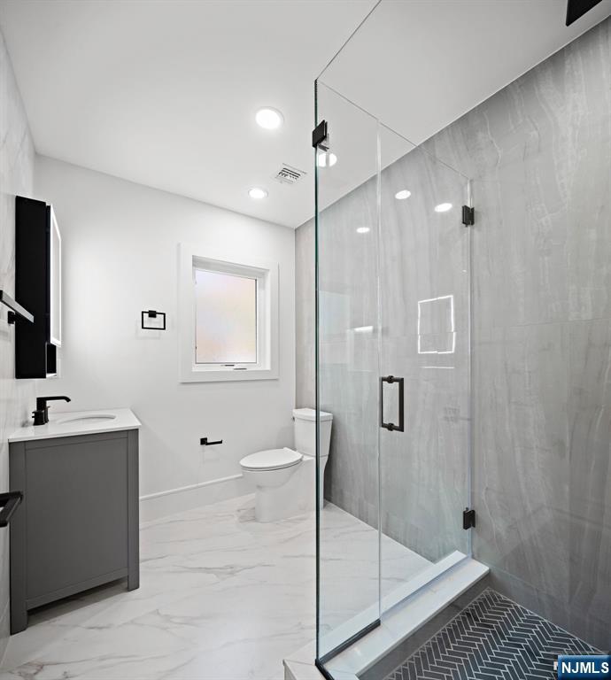 187 Brookfield Avenue Paramus, NJ 07652 - Photo 18 of 22 a bathroom with a shower a toilet and sink