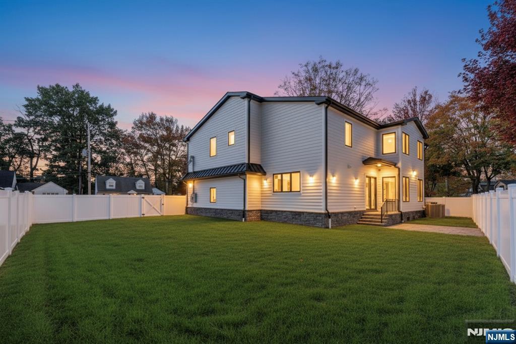 187 Brookfield Avenue Paramus, NJ 07652 - Photo 22 of 22 a front view of a house with a yard