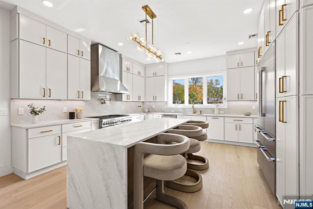 187 Brookfield Avenue Paramus, NJ 07652 - Photo 3 of 22 a kitchen with a sink appliances cabinets and furniture